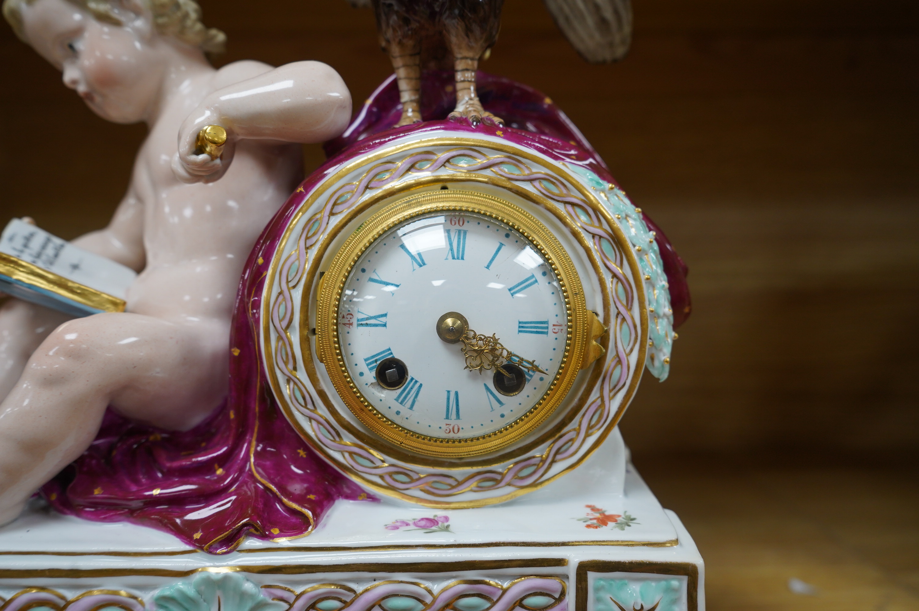 A Meissen figural mantel clock with cockerel surmount, French movement striking on a bell, 29cm high. Condition - poor